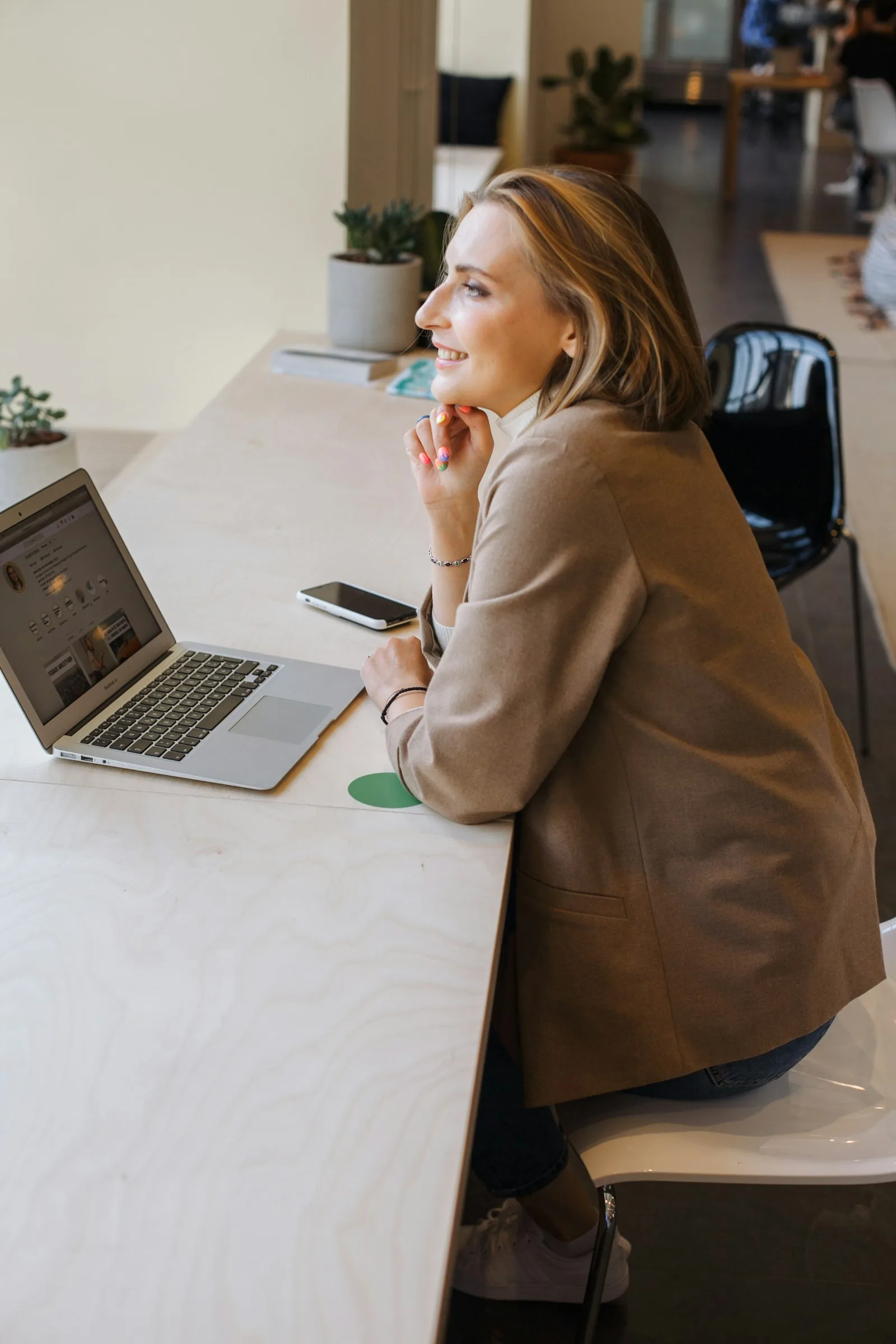 A businesswoman working on a laptop