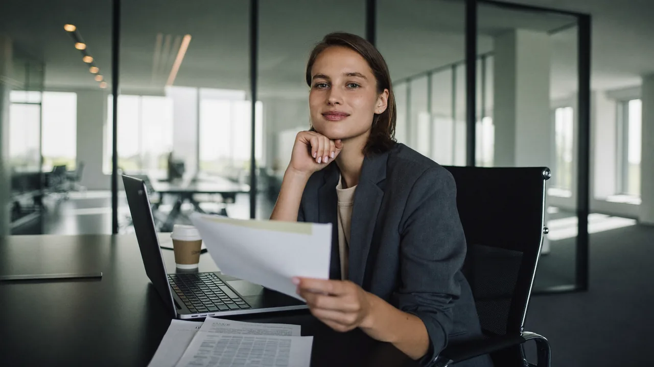A business owner going through invoices at her desk