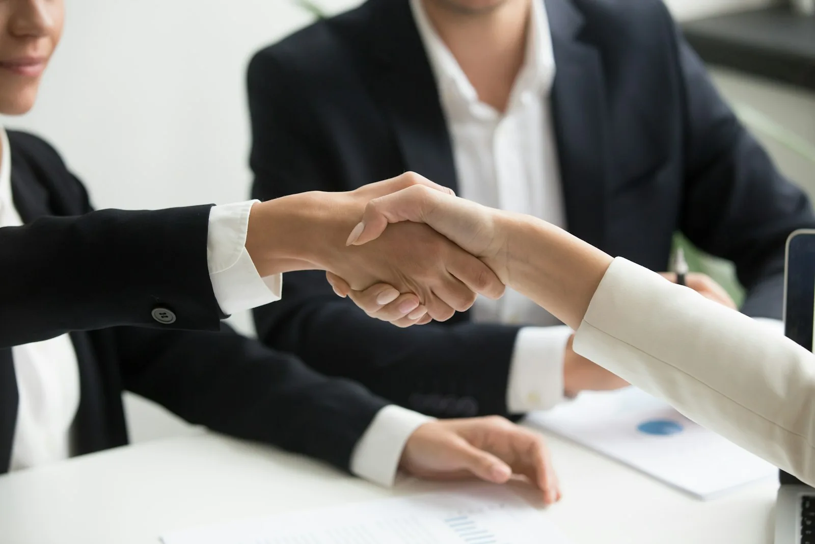Two people agreeing over a table